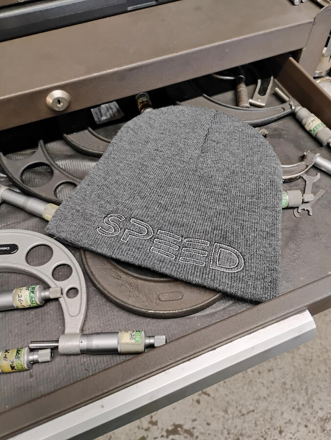 The Black Flag Skull Cap is speed with nothing extra. Low profile. No cuff. No bulk. The front features the Black Flag SPEED logo. Around back, the Speed Hat Co. Star logo — subtle, intentional, and unmistakable.