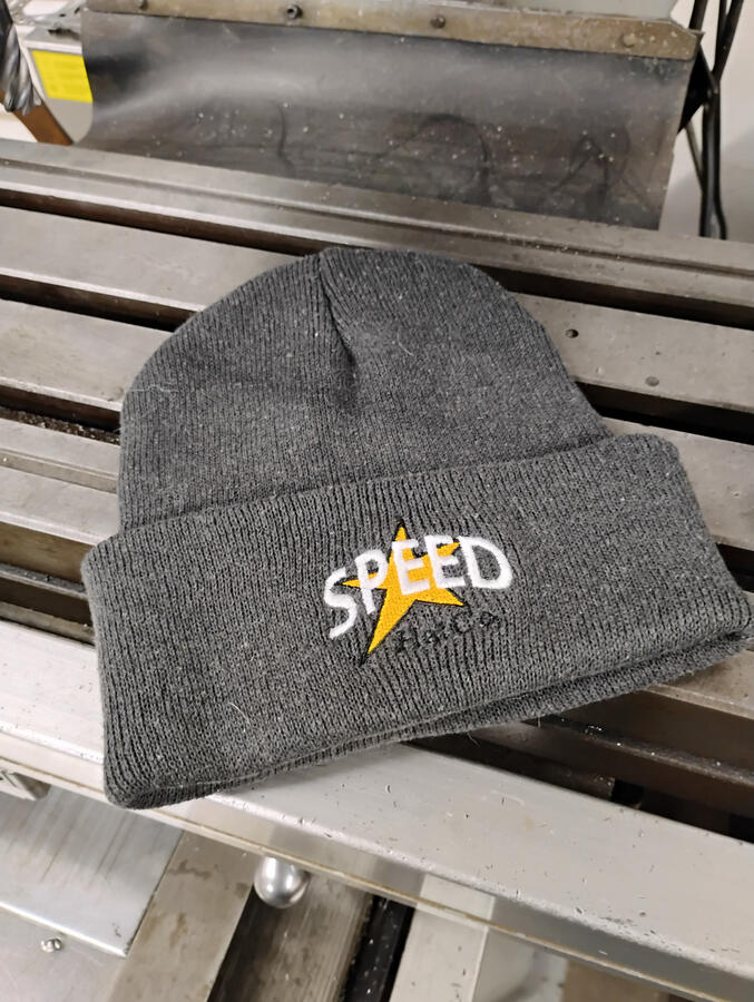 The Black Flag Cuff Beanie. A traditional cuffed beanie built for cold race nights, early mornings, and long hours in the garage. The Black Flag SPEED logo front and Speed Hat Co. Star logo on the back. Timeless. Functional. Zero noise.